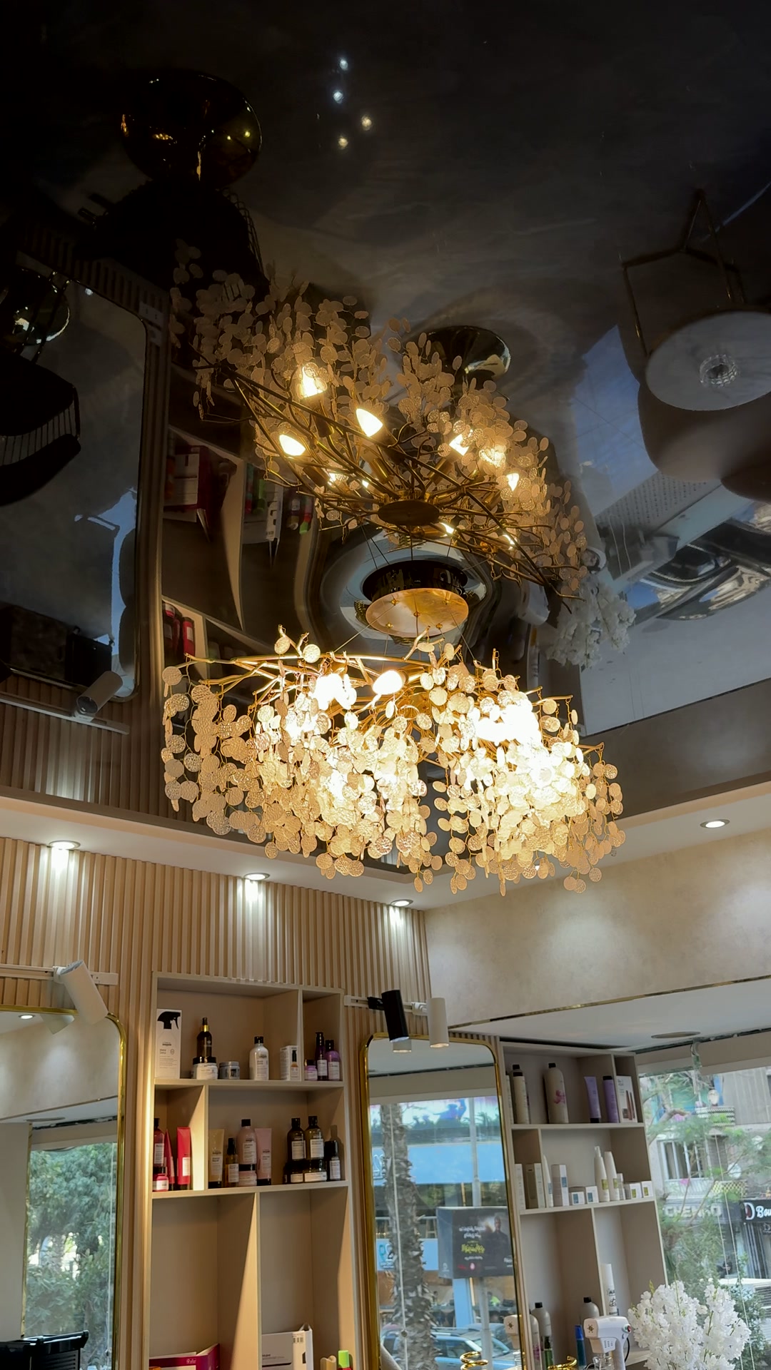 The golden chandelier and lighting details inside BQueen